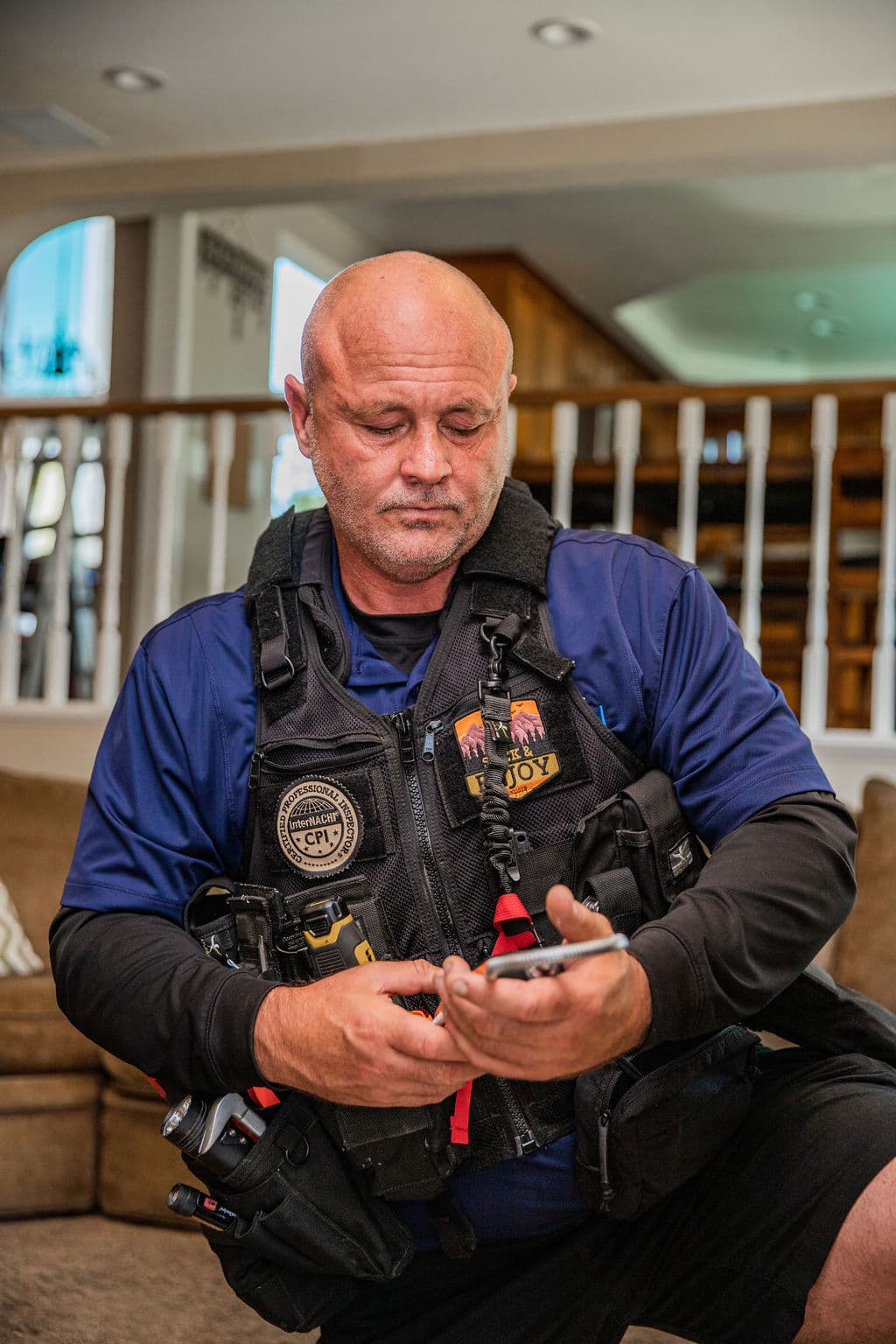 Trident inspector reviewing findings inside a two-story Orange County home